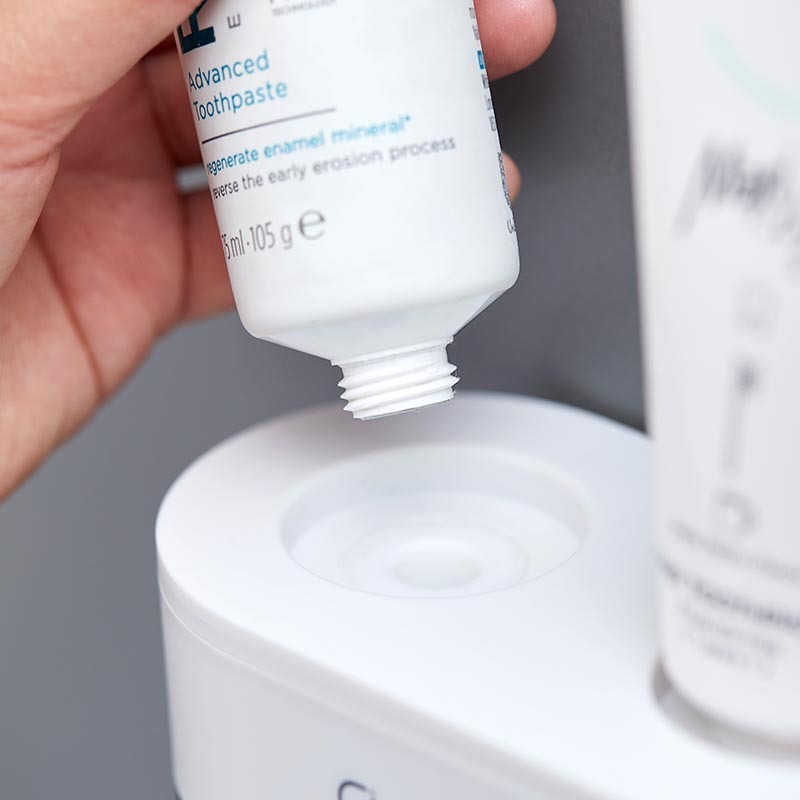 Hanging squeezer toothbrush